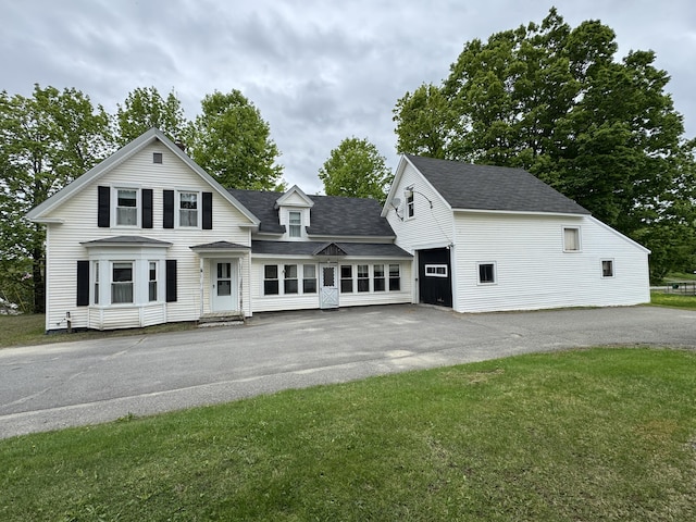 143 Main St, Sangerville, ME 04479 - view of front of home featuring asphalt driveway, roof with shingles, and a front lawn