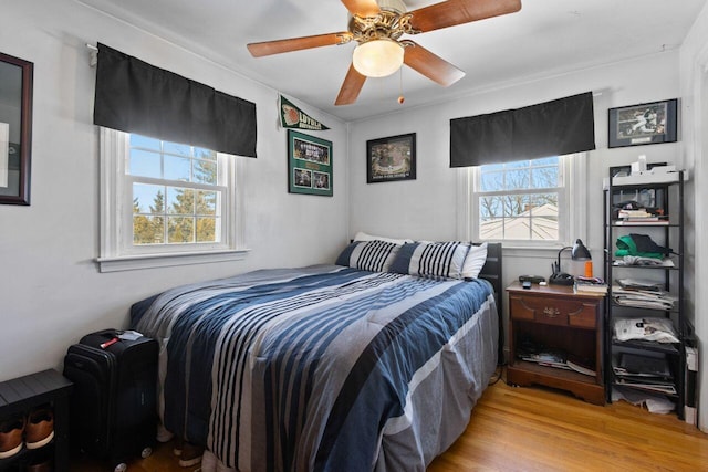 bedroom featuring a ceiling fan and wood finished floors