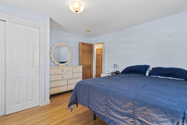 bedroom featuring light wood-style floors