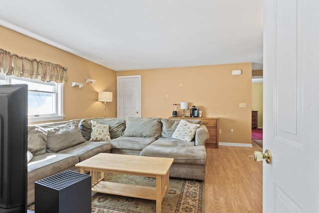 living room with light wood finished floors and baseboards