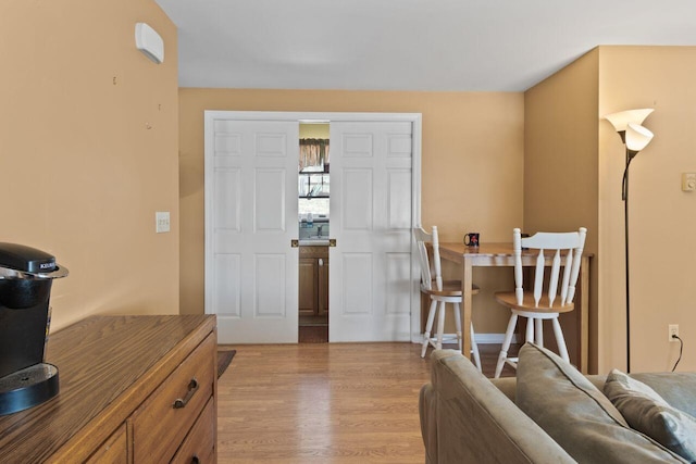 dining space with light wood-style flooring