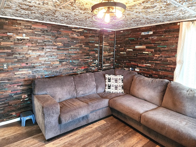 living area featuring an ornate ceiling and wood finished floors