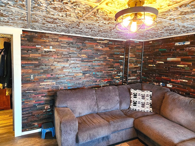 living area featuring an ornate ceiling and wood finished floors