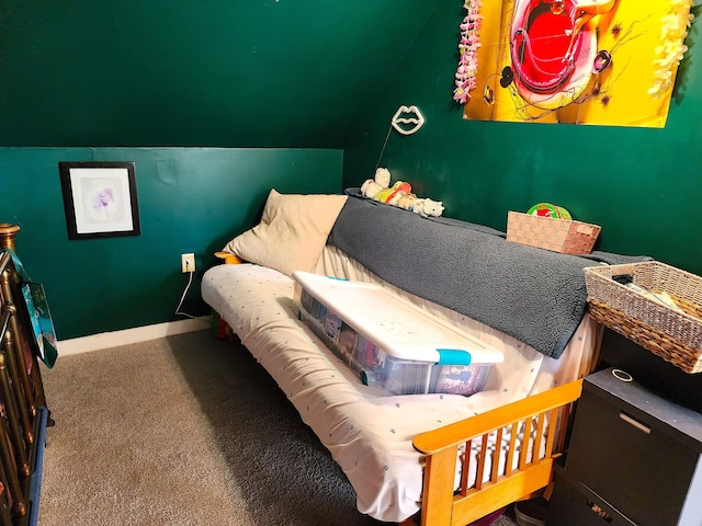 bedroom featuring carpet floors, lofted ceiling, and baseboards