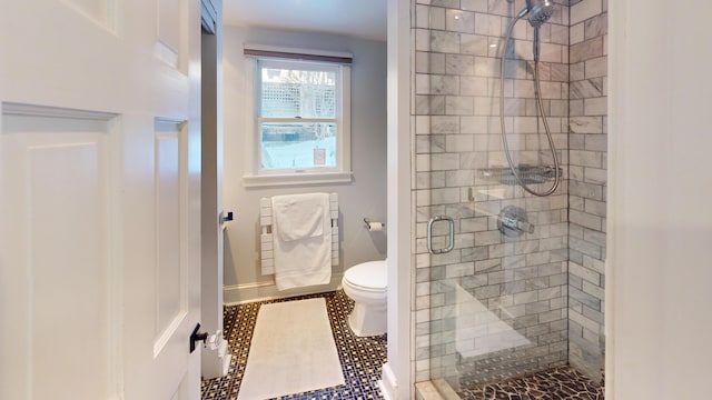 full bath with toilet, a shower stall, and radiator heating unit