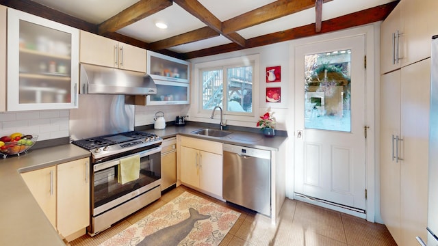 kitchen with stainless steel appliances, tasteful backsplash, a sink, beamed ceiling, and under cabinet range hood