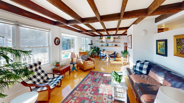 living room with coffered ceiling, wood finished floors, and beam ceiling