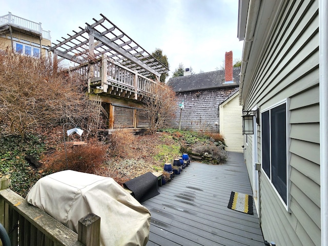 wooden terrace featuring grilling area