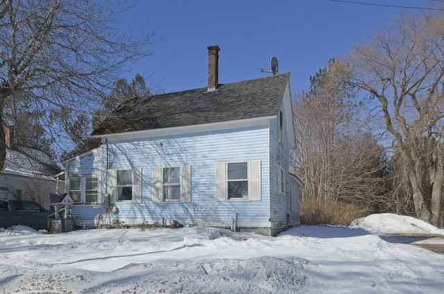 view of front of home featuring a shingled roof