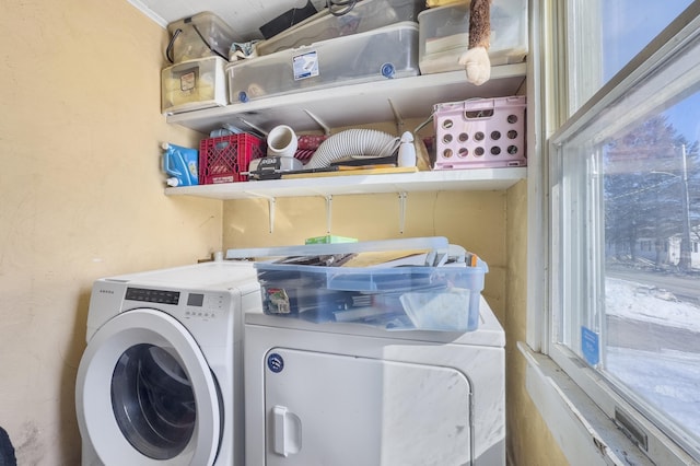 laundry room featuring laundry area and washing machine and clothes dryer