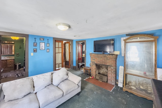 living area featuring a brick fireplace