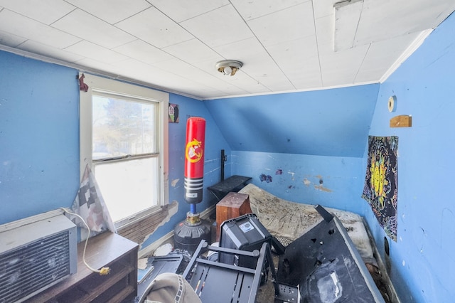 bedroom featuring lofted ceiling and crown molding