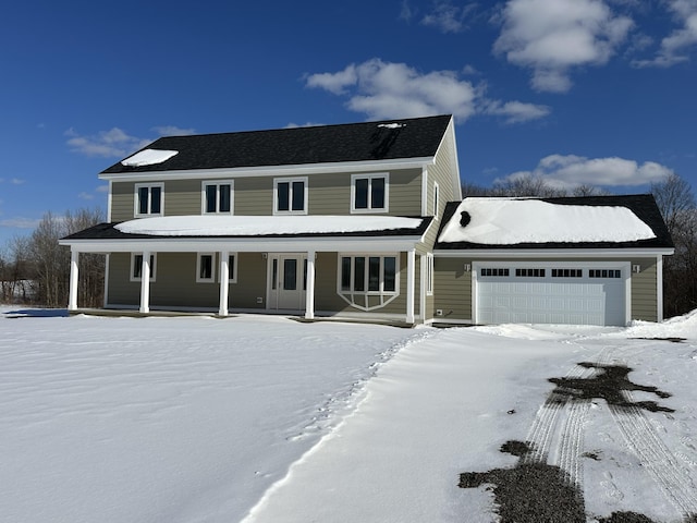 view of front of property featuring a garage and a porch