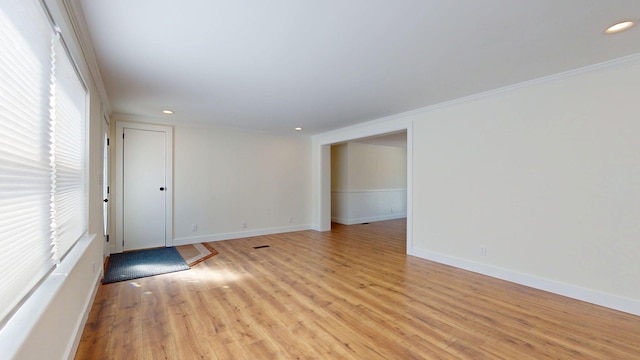 empty room with recessed lighting, baseboards, and light wood-style floors