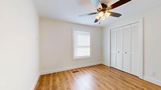 unfurnished bedroom with light wood-style flooring, baseboards, and visible vents