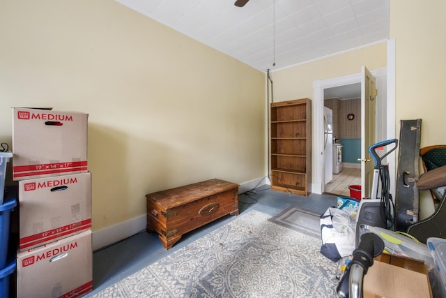 interior space featuring washer / clothes dryer and baseboards