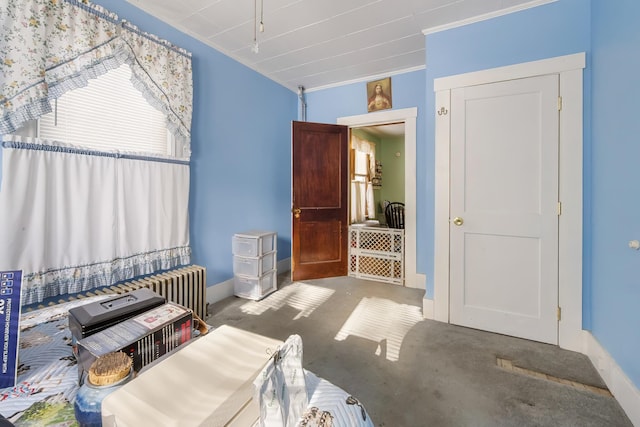 carpeted bedroom featuring baseboards