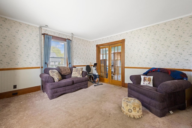 70 Savage St, Bangor, ME 04401 - carpeted living area featuring french doors, a wainscoted wall, crown molding, and wallpapered walls