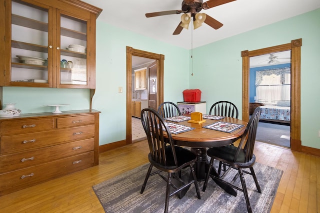 70 Savage St, Bangor, ME 04401 - dining room with light wood finished floors, ceiling fan, and baseboards