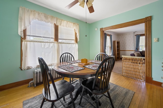 70 Savage St, Bangor, ME 04401 - dining space featuring wood-type flooring, ceiling fan, wallpapered walls, baseboards, and wainscoting