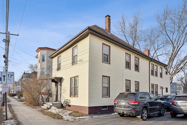 view of home's exterior featuring a chimney