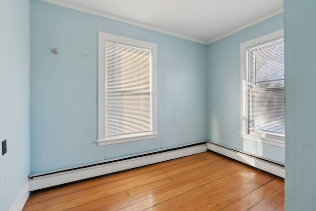 unfurnished room featuring wood-type flooring and ornamental molding