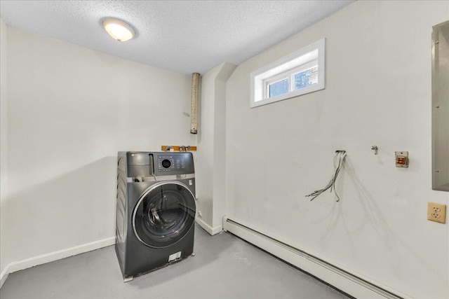 laundry room with laundry area, baseboards, a baseboard radiator, washer / clothes dryer, and a textured ceiling