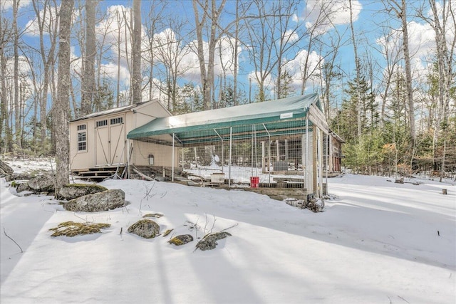 view of front of property with an outbuilding