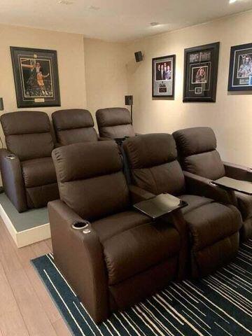 home theater room featuring light wood-type flooring