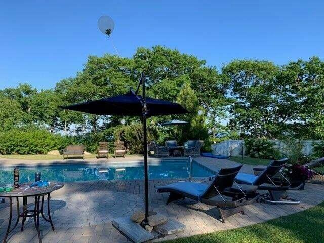 view of pool with a fenced in pool, a patio area, and fence