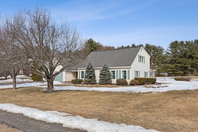 view of front facade with a shingled roof