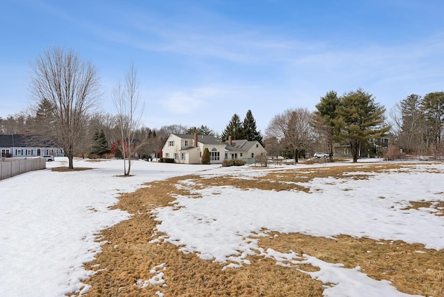 view of yard covered in snow