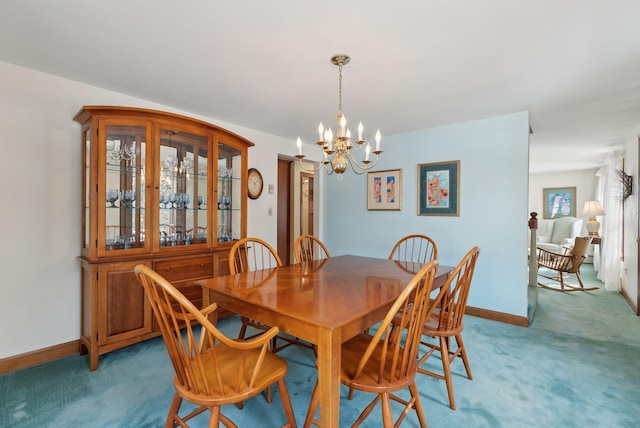 dining area with baseboards, a chandelier, and light carpet