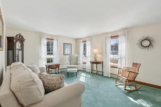 sitting room featuring baseboards and carpet flooring