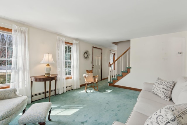 living area featuring stairs, plenty of natural light, and carpet