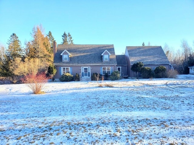 new england style home with entry steps