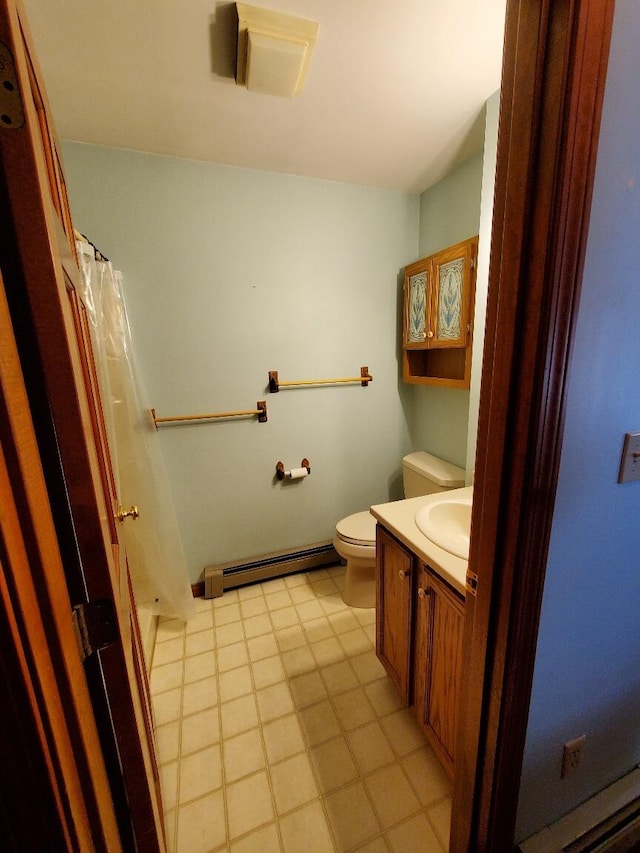 full bathroom with toilet, curtained shower, a baseboard heating unit, and vanity