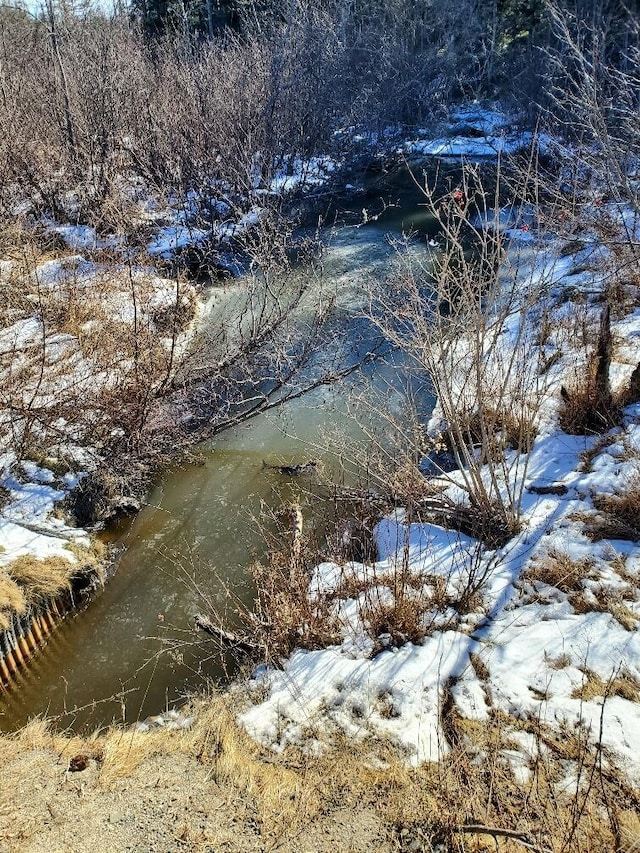 snowy landscape with a water view