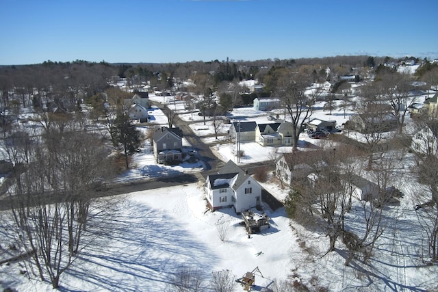 snowy aerial view with a residential view