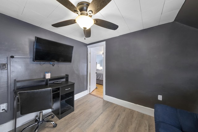 office area featuring ceiling fan, baseboards, and wood finished floors