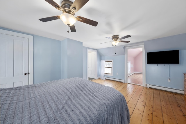 unfurnished bedroom featuring baseboards, a ceiling fan, a baseboard radiator, baseboard heating, and light wood-style floors