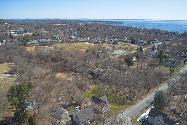 drone / aerial view with a water view and a residential view