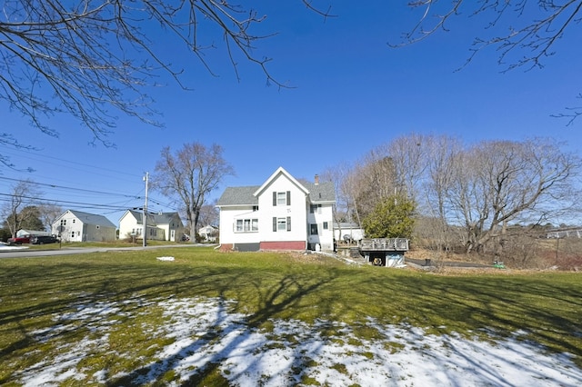 back of house with a yard