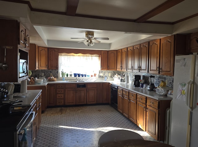 kitchen featuring appliances with stainless steel finishes, decorative backsplash, and brown cabinets