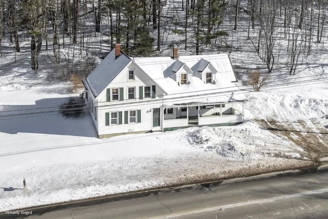 view of front of home featuring a chimney