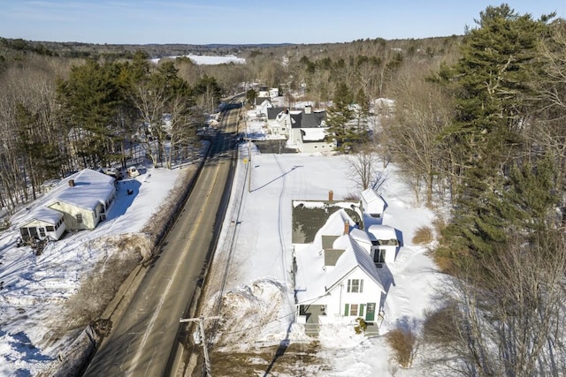 snowy aerial view featuring a residential view