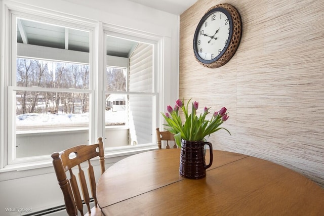 dining area with a baseboard radiator