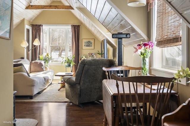 living area featuring dark wood-type flooring, wood ceiling, and vaulted ceiling with beams