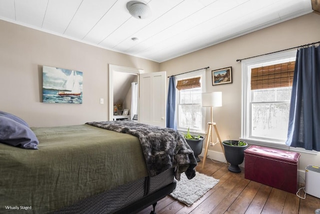 bedroom with hardwood / wood-style floors