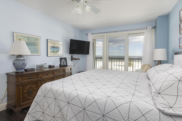 bedroom with access to exterior, ceiling fan, and baseboards